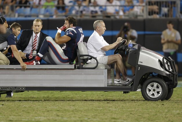 New England Patriots' James Develin (46) is carted off the field after being injured against the Carolina Panthers during the second half of a preseason NFL football game in Charlotte, N.C., Friday, Aug. 28, 2015. (AP Photo/Bob Leverone)