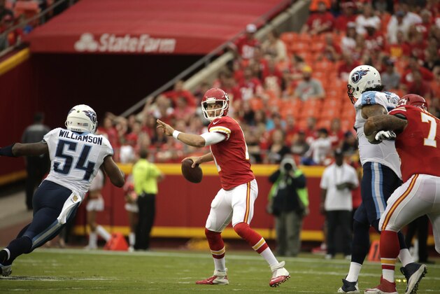 Kansas City Chiefs quarterback Alex Smith (11) throws under pressure from Tennessee Titans linebacker Avery Williamson (54) during the first half of a preseason NFL football game at Arrowhead Stadium in Kansas City, Mo., Friday, Aug. 28, 2015. (AP Photo/Charlie Riedel)