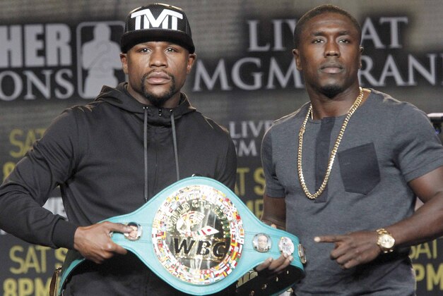 Floyd Mayweather Jr., left, and Andre Berto pose at a news conference in Los Angeles on Thursday, Aug. 6, 2015. Mayweather says Berto is a worthy opponent for the final fight of his perfect career. (AP Photo/Nick Ut)