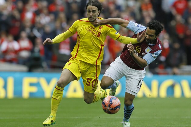 Liverpool's Lazar Markovic, left, vies for the ball with Aston Villa’s Kieran Richardson during the English FA Cup semifinal soccer match between Liverpool and  Aston Villa at Wembley Stadium in London, Sunday, April 19, 2015. (AP Photo/Kirsty Wigglesworth)