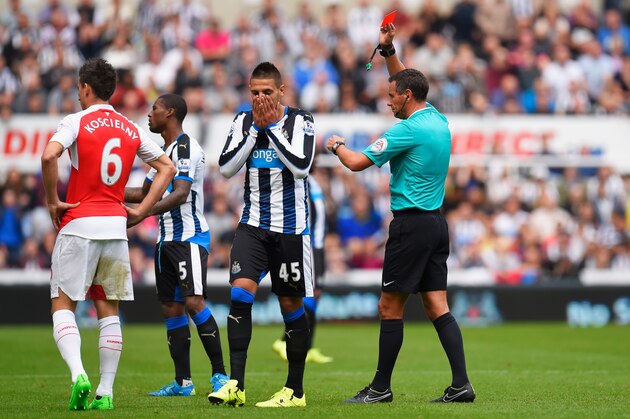 NEWCASTLE UPON TYNE, ENGLAND - AUGUST 29:  Aleksandar Mitrovic (2nd R) of Newcastle United is shown a red card by referee Andre Marriner (1st R) during the Barclays Premier League match between Newcastle United and Arsenal at St James' Park on August 29, 2015 in Newcastle upon Tyne, England.  (Photo by Stu Forster/Getty Images)