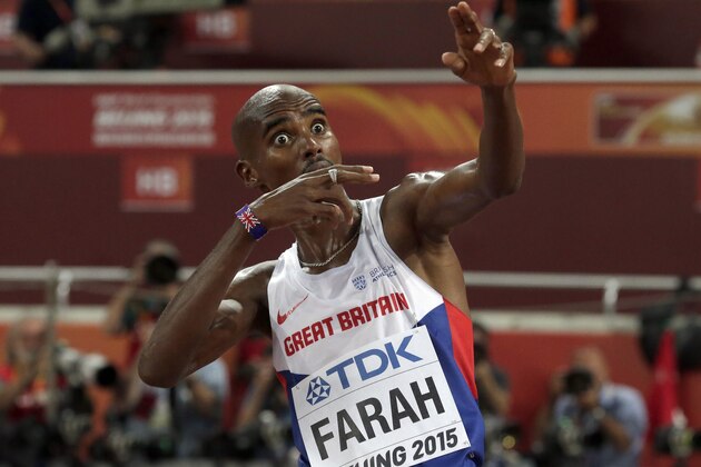 Britain's Mo Farah celebrates winning the men's 5000m final at the World Athletics Championships at the Bird's Nest stadium in Beijing, Saturday, Aug. 29, 2015. (AP Photo/Andy Wong)