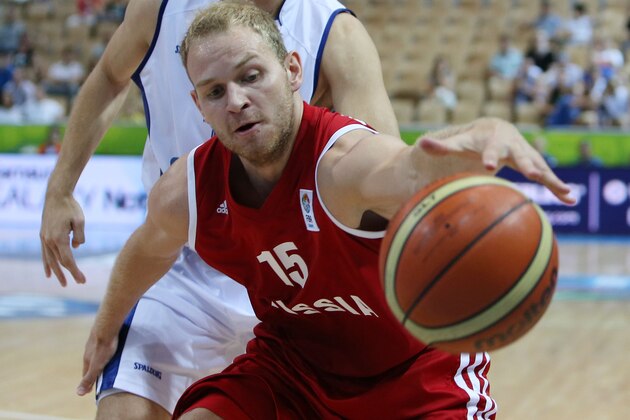 Finland's Mikko Koivisto, background, runs to stop Russia's Anton Ponkrashov during their EuroBasket European Basketball Championship Group D match at the Bonifika Arena, in Koper, Slovenia, Sunday, Sept. 8, 2013. (AP Photo/Thanassis Stavrakis)
