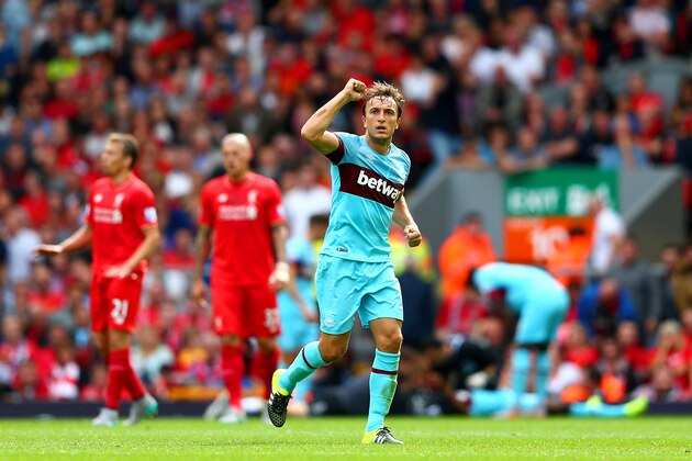 LIVERPOOL, ENGLAND - AUGUST 29:  Mark Noble of West Ham United celebrates scoring his team's second goal from the penalty spot during the Barclays Premier League match between Liverpool and West Ham United at Anfield on August 29, 2015 in Liverpool, England.  (Photo by Clive Mason/Getty Images)
