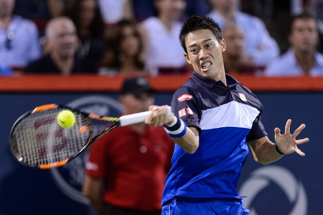 MONTREAL, ON - AUGUST 15:  Kei Nishikori of Japan hits the ball against Andy Murray of Great Britain during day six of the Rogers Cup at Uniprix Stadium on August 15, 2015 in Montreal, Quebec, Canada.  (Photo by Minas Panagiotakis/Getty Images)