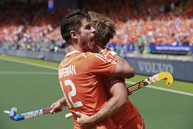 Netherlands' Robbert Kemperman, left, is hugged by teammate Netherlands' Jeroen Hertzberger, right, after Kemperman scored 1-0 during the men's final of the Field Hockey World Cup between Australia and The Netherlands in The Hague, Netherlands, Sunday, June 15, 2014. Australia won the match with a 6-1 score to win the World Cup. (AP Photo/Peter Dejong)
