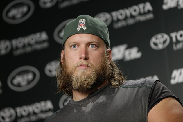 New York Jets' Nick Mangold speaks to reporters after NFL football practice in Florham Park, N.J., Tuesday, Aug. 11, 2015. Quarterback Geno Smith will be sidelined at least 6-10 weeks with a broken jaw after being punched by teammate Ikemefuna Enemkpali in the locker room Tuesday morning. Smith, entering his third season, required surgery to repair the injuries. (AP Photo/Seth Wenig)