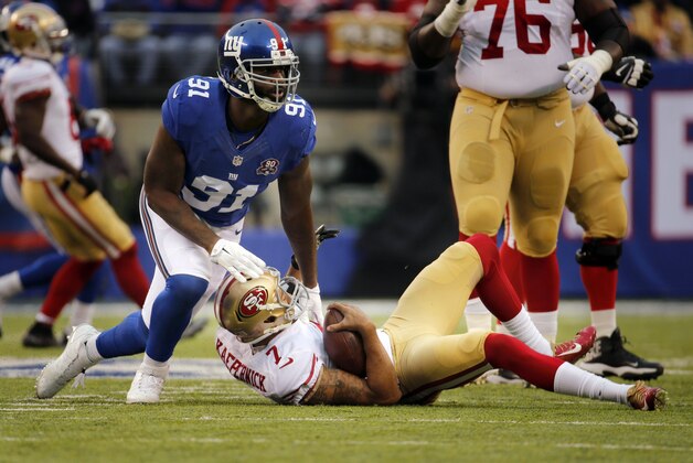 Sep 25, 2014; New York, NY, USA; New York Giants defensive end Robert Ayers (91) sacks San Francisco 49ers quarterback Colin Kaepernick (7) during the first half at Metlife Stadium. Mandatory Credit: John Munson/NJ Advance Media for NJ.com via USA TODAY Sports