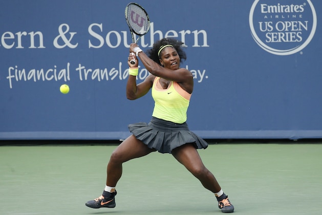 Serena Williams returns the ball to Simona Halep, of Romania, during a final match at the Western & Southern Open tennis tournament, Sunday, Aug. 23, 2015, in Mason, Ohio. Williams defeated Halep 6-3, 7-6 (5). (AP Photo/John Minchillo)