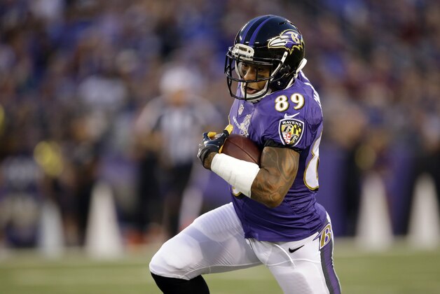 Baltimore Ravens wide receiver Steve Smith runs for a touchdown in the first half of a preseason NFL football game against the Baltimore Ravens, Saturday, Aug. 29, 2015, in Baltimore. (AP Photo/Patrick Semansky)