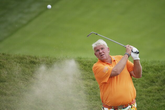 John Daly hits out of a bunker on the 18th hole during the second round of the PGA Championship golf tournament Friday, Aug. 14, 2015, at Whistling Straits in Haven, Wis. (AP Photo/Chris Carlson)
