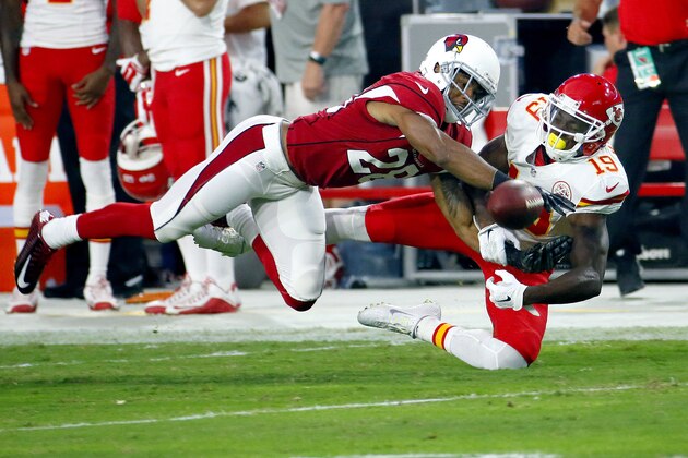 Arizona Cardinals cornerback Justin Bethel (28) breaks up a pass intended for Kansas City Chiefs wide receiver Jeremy Maclin (19) during the first half of an NFL preseason football game, Saturday, Aug. 15, 2015, in Glendale, Ariz. (AP Photo/Matt York)