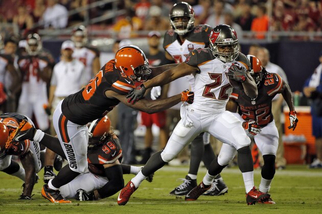 Tampa Bay Buccaneers running back Doug Martin (22) sidesteps Cleveland Browns strong safety Donte Whitner (31), -pcd22n= and inside linebacker Karlos Dansby (56) to score on a 19-yard touchdown run during the second quarter of an NFL preseason football game Saturday, Aug. 29, 2015, in Tampa, Fla. (AP Photo/Scott Audette)