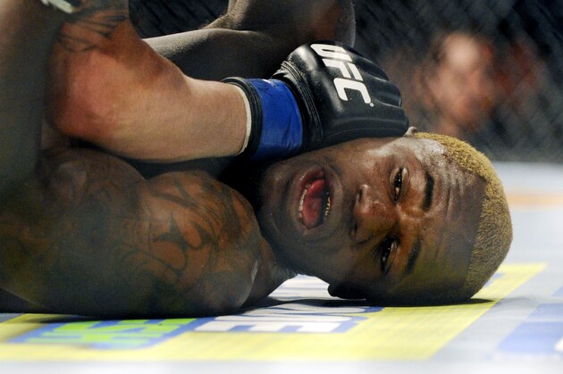 Jamie Varner pins Melvin Guillard on the mat during their UFC 155 lightweight bout at the MGM Grand Garden Arena Saturday, Dec, 29, 2012 in Las Vegas. Varner won the mixed martial arts match by a split decision. (AP Photo/David Becker)