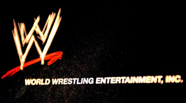 NEW YORK - MARCH 18:  The World Wrestling Entertainment logo hangs on a wall at a media conference announcing the all-star lineup of WWE WrestleMania XIX at ESPN Zone in Times Square March 18, 2003 in New York City.  (Photo by Mark Mainz/Getty Images)