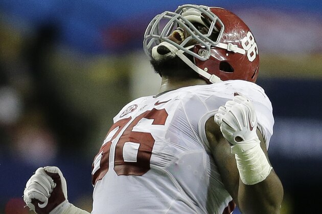 Alabama defensive lineman A'Shawn Robinson (86) celebrates a sack on Missouri quarterback Maty Mauk during the second half of the Southeastern Conference championship NCAA college football game, Saturday, Dec. 6, 2014, in Atlanta. (AP Photo/Jamie Martin)
