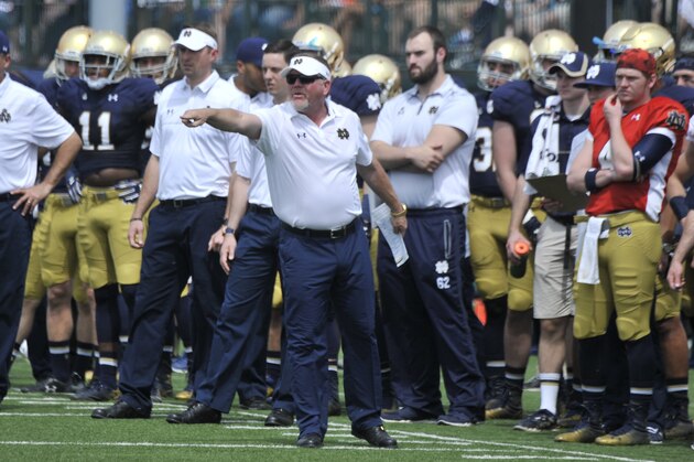 Notre Dame coach Brian Kelly shouts instructions to his players  during the Blue Gold game Saturday April 18, 2015 in South Bend, Ind. (AP Photo/Joe Raymond)