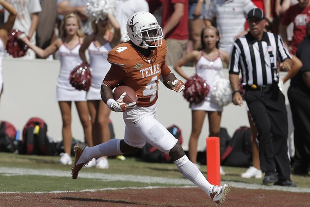 Texas  Daje Johnson (4) scores a touchdown on a punt return during the third quarter of an NCAA college football game against Oklahoma at the Cotton Bowl  Saturday, Oct. 12, 2013, in Dallas. Texas won 36-20. (AP Photo/Brandon Wade)