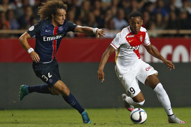 Paris Saint-Germain's Brazilian defender David Luiz (L) vies with Monaco's French forward Anthony Martial during the French L1 football match Monaco (ASM) vs Paris Saint-Germain (PSG), on August 30, 2015 at the Louis II stadium in Monaco.   AFP PHOTO / VALERY HACHE        (Photo credit should read VALERY HACHE/AFP/Getty Images)