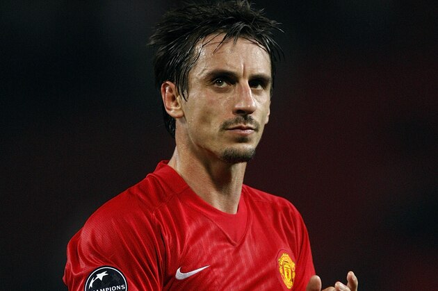 Manchester United's Gary Neville reacts towards the home fans at the final whistle during their UEFA Champions League group E soccer match against Villarreal at Old Trafford Stadium, Manchester, England, Wednesday Sept. 17, 2008. The game ended 0-0. (AP Photo/Jon Super)