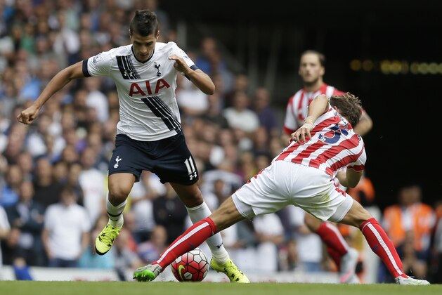 Stoke’s Marc Muniesa, right, tackles Tottenham’s Erik Lamela during the English Premier League soccer match between Tottenham Hotspur and Stoke City at White Hart Lane, London, Saturday, Aug. 15, 2015. (AP Photo/Tim Ireland)