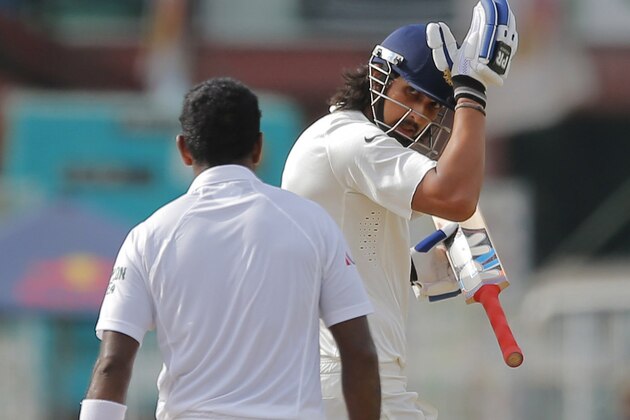 Sri Lankan bowler Dhammika Prasad, back to camera and India's Ishant Sharma exchange words on day four of the third test cricket match between them in Colombo, Sri Lanka, Monday, Aug. 31, 2015. (AP Photo/Eranga Jayawardena)