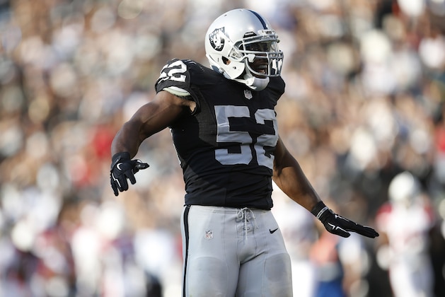 Oakland Raiders outside linebacker Khalil Mack (52) reacts after sacking Arizona Cardinals quarterback Carson Palmer during the first half of an NFL preseason football game in Oakland, Calif., Sunday, Aug. 30, 2015. (AP Photo/Tony Avelar)