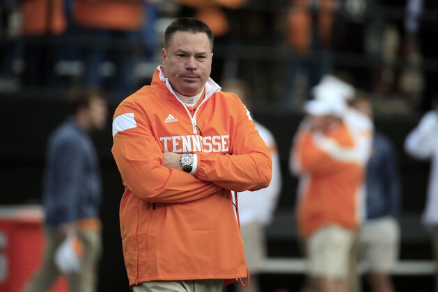 Tennessee head coach Butch Jones watches his players warm up before an NCAA college football game against Vanderbilt Saturday, Nov. 29, 2014, in Nashville, Tenn. (AP Photo/Mark Humphrey)