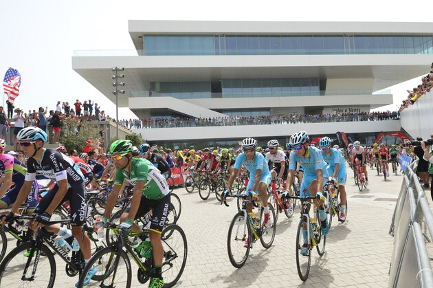The pack rides prior to the start of the tenth stage of the 2015 Vuelta Espana cycling tour, a 146.6km stage between Valencia and Castellon on August 31, 2015.   AFP PHOTO/ JOSE JORDAN        (Photo credit should read JOSE JORDAN/AFP/Getty Images)