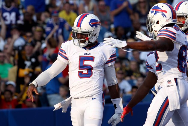 Aug 29, 2015; Orchard Park, NY, USA; Buffalo Bills quarterback Tyrod Taylor (5) celebrates his second half touchdown against the Pittsburgh Steelers at Ralph Wilson Stadium. Bills beat the Steelers 43 to 19. Mandatory Credit: Timothy T. Ludwig-USA TODAY Sports