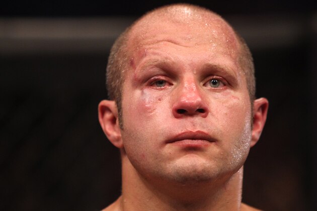 HOFFMAN ESTATES, IL - JULY 30:  A disappointed Fedor Emelianenko stands in the cage after his loss to Dan Henderson by TKO in a heavyweight fight at the Strikeforce event at Sears Centre Arena on July 30, 2011 in Hoffman Estates, Illinois.  (Photo by Josh Hedges/Forza LLC/Forza LLC via Getty Images)