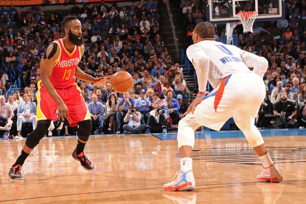 OKLAHOMA CITY, OK- APRIL 5:  James Harden #13 of the Houston Rockets dribbles the ball while defended by Russell Westbrook #0 of the Oklahoma City Thunder on April 5, 2015 at Chesapeake Energy Arena in Oklahoma City, Oklahoma. NOTE TO USER: User expressly acknowledges and agrees that, by downloading and or using this photograph, User is consenting to the terms and conditions of the Getty Images License Agreement. Mandatory Copyright Notice: Copyright 2015 NBAE (Photo by Bill Baptist/NBAE via Getty Images)