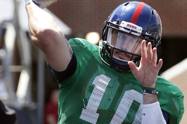 Mississippi quarterback Chad Kelly (10) throws warmup passes prior to the start of the team's spring college football  game, Saturday, April 11, 2015, in Oxford, Miss. (AP Photo/Rogelio V. Solis)