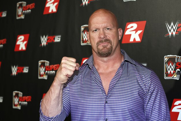 IMAGE DISTRIBUTED FOR 2K - WWE Hall of Famer and WWE 2K16 cover, Superstar Stone Cold Steve Austin arrives on the red carpet at the WWE 2K SummerSlam Kickoff in New York, N.Y., on Thursday, Aug. 20, 2015. (Photo by Stuart Ramson/Invision for 2K/AP Images)