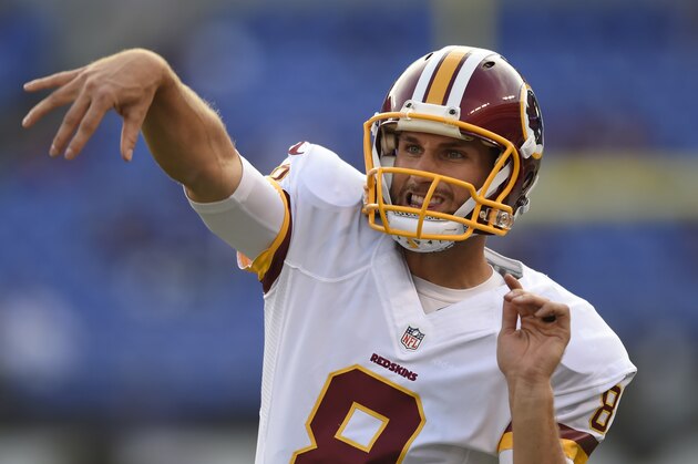 FILE - In this Aug. 29, 2015, photo, Washington Redskins quarterback Kirk Cousins warms up before a preseason NFL football game against the Baltimore Ravens in Baltimore. The Washington Redskins have made a quarterback change: Kirk Cousins will be the starter this season, not Robert Griffin III. (AP Photo/Gail Burton, File)
