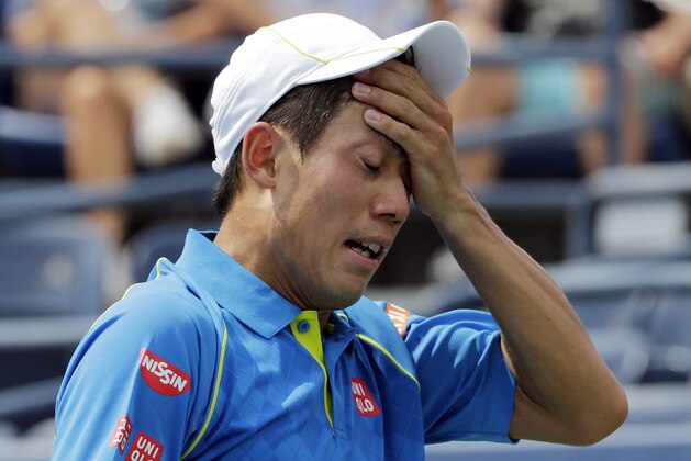 Kei Nishikori, of Japan, reacts after losing a point to Benoit Paire, of France, during the first round of the U.S. Open tennis tournament, Monday, Aug. 31, 2015, in New York. (AP Photo/Charles Krupa)