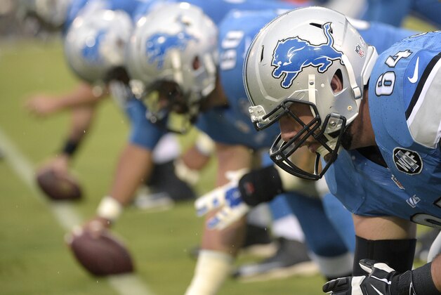 Detroit Lions center Travis Swanson (64) warms up before a preseason NFL football game against the Jacksonville Jaguars in Jacksonville, Fla., Friday, Aug. 28, 2015. (AP Photo/Phelan M. Ebenhack)