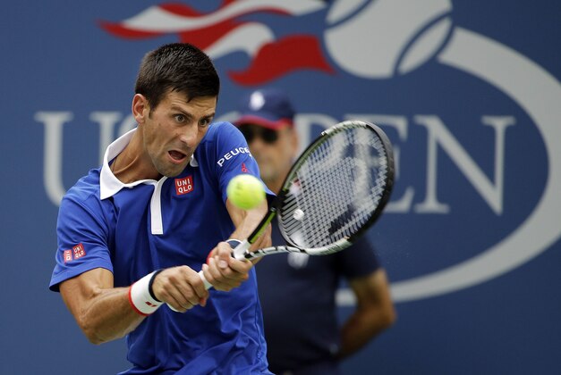 Novak Djokovic, of Serbia, returns a shot against Joao Souza, of Brazil, during the first round of the U.S. Open tennis tournament, Monday, Aug. 31, 2015, in New York. (AP Photo/Matt Rourke)