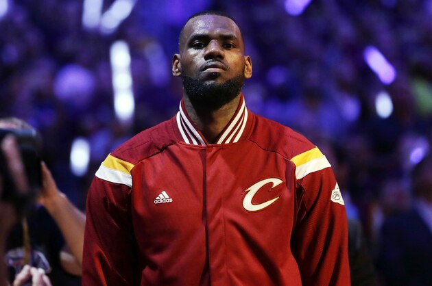 Cleveland Cavaliers forward LeBron James (23) waits during the playing of the national anthem before the start of Game 6 of basketball's NBA Finals against the Golden State Warriors, in Cleveland, Tuesday, June 16, 2015. (AP Photo/Tony Dejak)