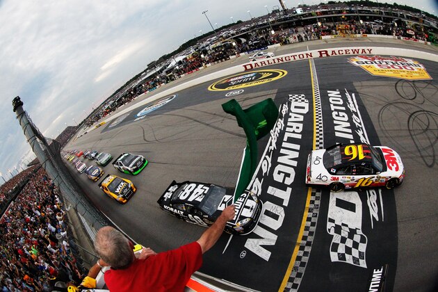 DARLINGTON, SC - MAY 12:  Greg Biffle, driver of the #16 3M/OH/ES Ford, and Jimmie Johnson, driver of the #48 Lowe's/Kobalt Tools Chevrolet, lead the field past the green flag to start the NASCAR Sprint Cup Series Bojangles' Southern 500 at Darlington Raceway on May 12, 2012 in Darlington, South Carolina.  (Photo by Tyler Barrick/Getty Images for NASCAR)