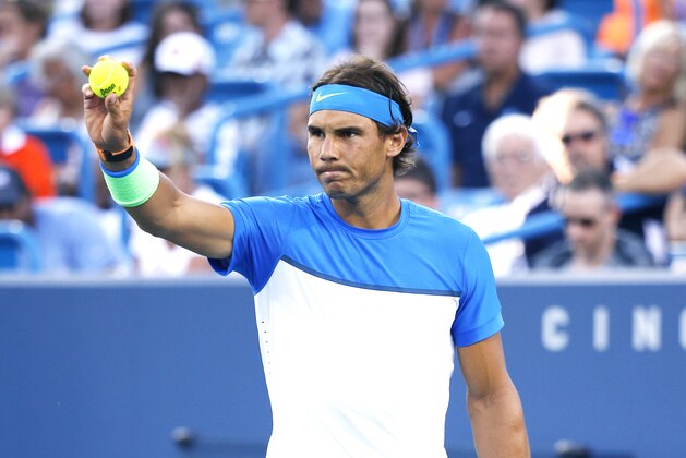 Rafael Nadal, of Spain, prepares to serve to Feliciano Lopez, of Spain, during a match at the Western & Southern Open tennis tournament, Thursday, Aug. 20, 2015, in Mason, Ohio. (AP Photo/John Minchillo)