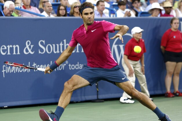 Roger Federer, of Switzerland, readies to hit a forehand to Feliciano Lopez, of Spain, during a quarterfinal at the Western & Southern Open tennis tournament, Friday, Aug. 21, 2015, in Mason, Ohio. Federer won 6-3, 6-4. (AP Photo/David Kohl)