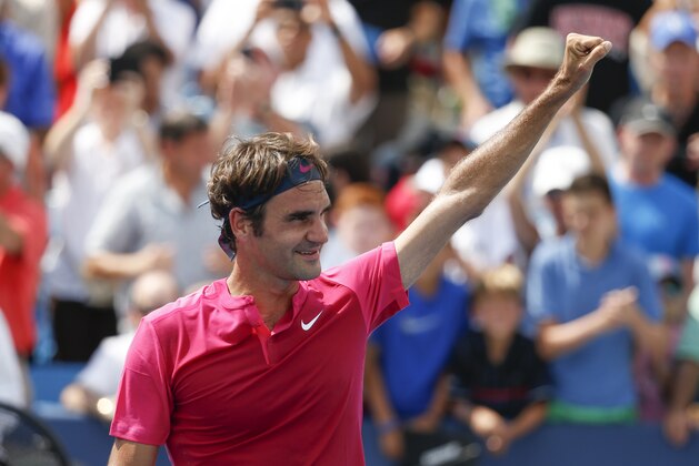 Roger Federer, of Switzerland, celebrates after defeating Novak Djokovic, of Serbia, in the men's final at the Western & Southern Open tennis tournament, Sunday, Aug. 23, 2015, in Mason, Ohio. Federer won 7-6 (1), 6-3. (AP Photo/John Minchillo)