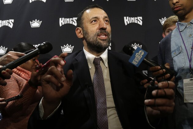 Retired Sacramento Kings center Vlade Divac, of Serbia, talks with reporters before the Kings played the Atlanta Hawks in NBA basketball game in Sacramento, Calif., Monday, March 16, 2015.  Divac has recently been named the Kings Vice President of Basketball and Franchise Operations.(AP Photo/Rich Pedroncelli)