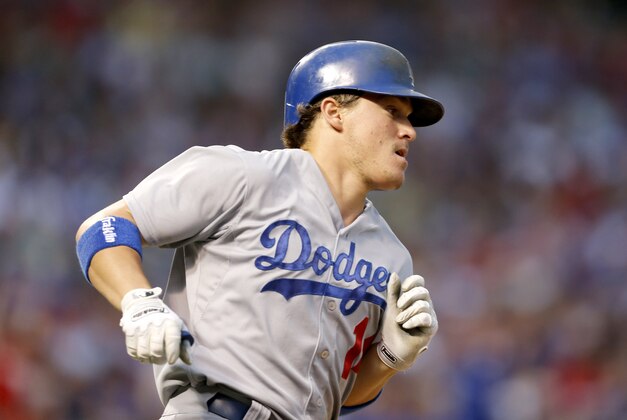 Los Angeles Dodgers' Kike Hernandez rounds the bases after hitting a home run off Chicago Cubs starting pitcher Tsuyoshi Wada, during the third inning of a baseball game Monday, June 22, 2015, in Chicago. (AP Photo/Charles Rex Arbogast)