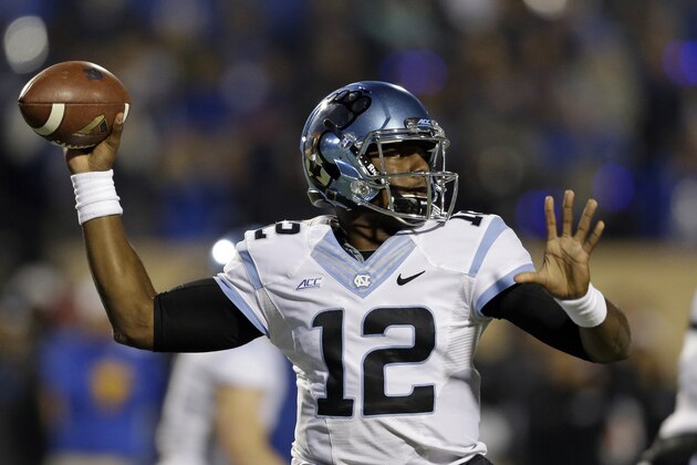North Carolina quarterback Marquise Williams (12) passes during the first half of an NCAA college football game against Duke in Durham, N.C., Thursday, Nov. 20, 2014. (AP Photo/Gerry Broome)