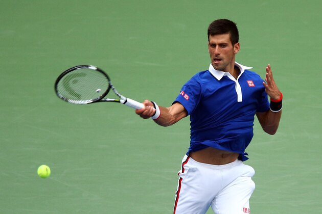 NEW YORK, NY - AUGUST 31:  Novak Djokovic of Serbia returns a shot against Joao Souza of Brazil in their Men's Singles First Round match on Day One of the 2015 US Open at the USTA Billie Jean King National Tennis Center on August 31, 2015 in the Flushing neighborhood of the Queens borough of New York City.  (Photo by Clive Brunskill/Getty Images)