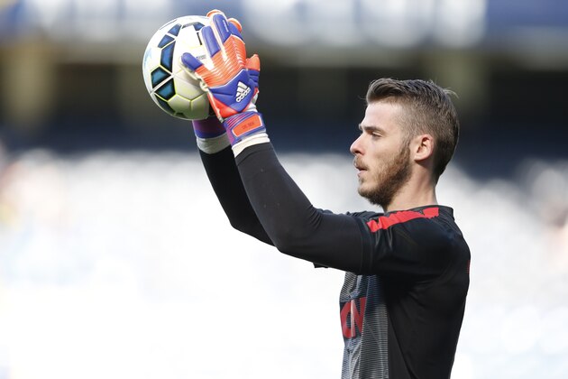 Manchester United's Spanish goalkeeper David de Gea warms up before the English Premier League football match between Chelsea and Manchester United at Stamford Bridge in London on April 18, 2015. AFP PHOTO / ADRIAN DENNIS

RESTRICTED TO EDITORIAL USE. No use with unauthorized audio, video, data, fixture lists, club/league logos or live services. Online in-match use limited to 45 images, no video emulation. No use in betting, games or single club/league/player publications.        (Photo credit should read ADRIAN DENNIS/AFP/Getty Images)