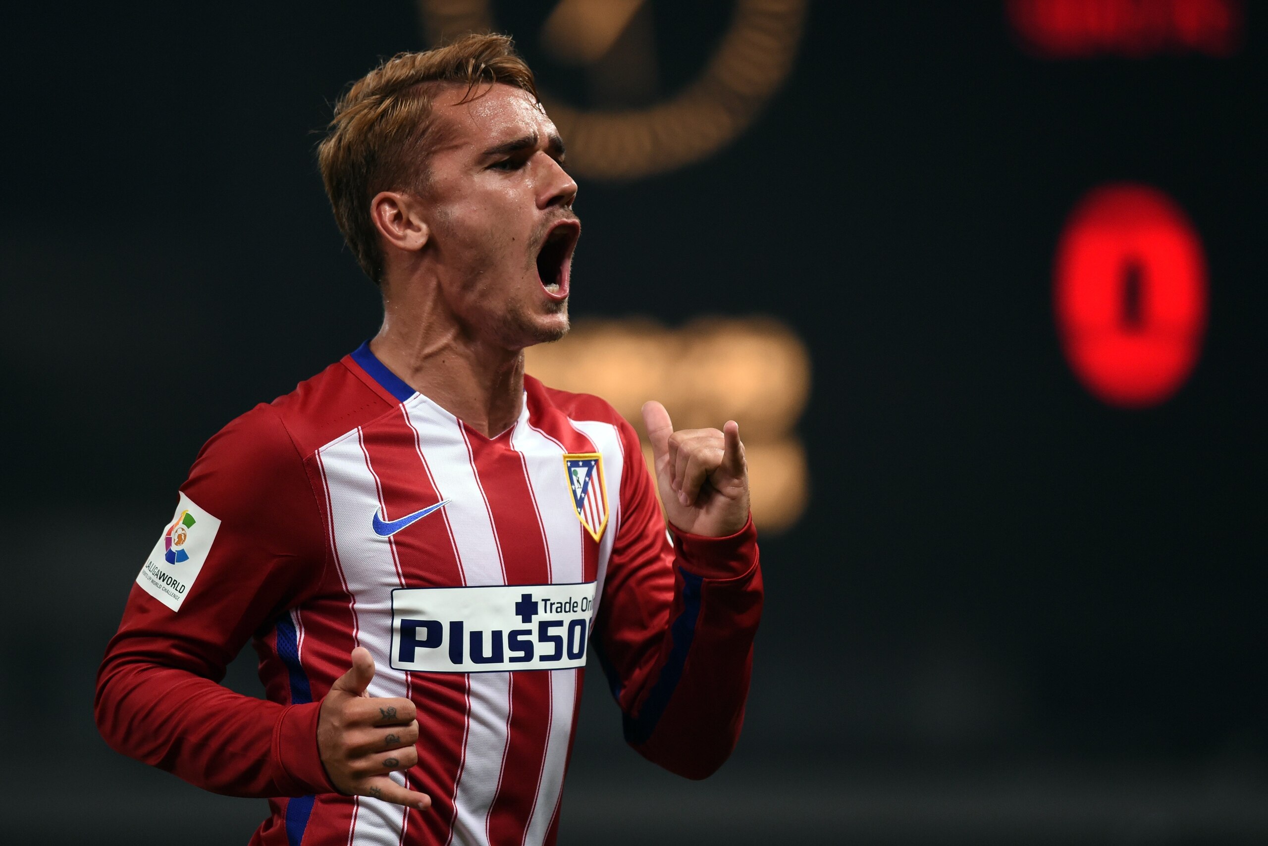 Atletico Madrid's French forward Antoine Griezmann celebrates his goal during a friendly football match between Shanghai SIPG and Atletico Madrid in Shanghai on August 4, 2015. AFP PHOTO / JOHANNES EISELE (Photo credit should read JOHANNES EISELE/AFP/Getty Images) Atletico Madrid's French forward Antoine Griezmann celebrates his goal during a friendly football match between Shanghai SIPG and Atletico Madrid in Shanghai on August 4, 2015. AFP PHOTO / JOHANNES EISELE (Photo credit should read JOHANNES EISELE/AFP/Getty Images)