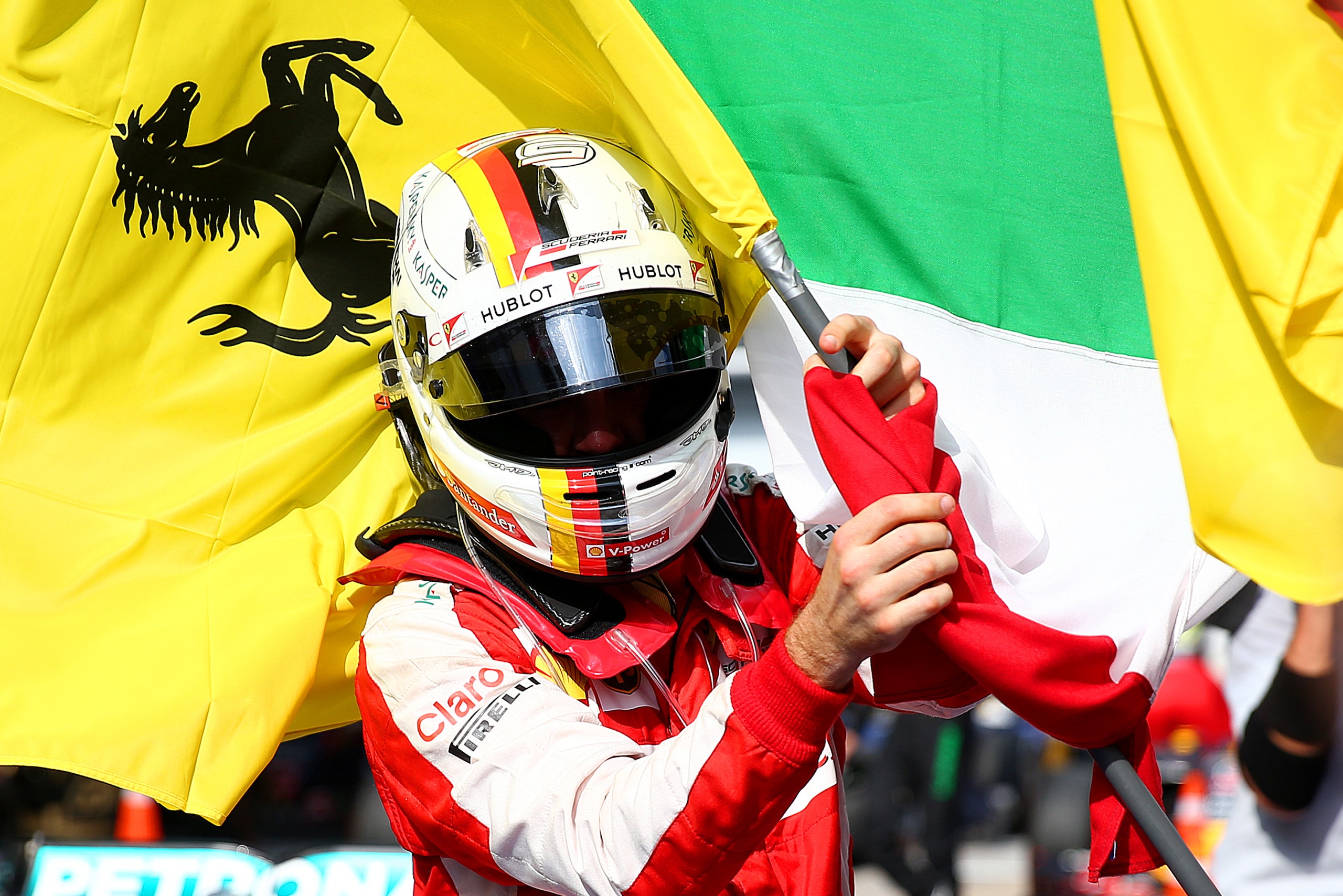 KUALA LUMPUR, MALAYSIA - MARCH 29:  Sebastian Vettel of Germany and Ferrari celebrates in Parc Ferme after winning the Malaysia Formula One Grand Prix at Sepang Circuit on March 29, 2015 in Kuala Lumpur, Malaysia.  (Photo by Dan Istitene/Getty Images)